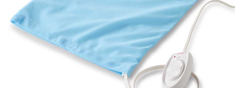 Heating pads massage add-on at Uniq Massage in McKinney TX using sustained heat to relax muscles and improve tissue receptivity