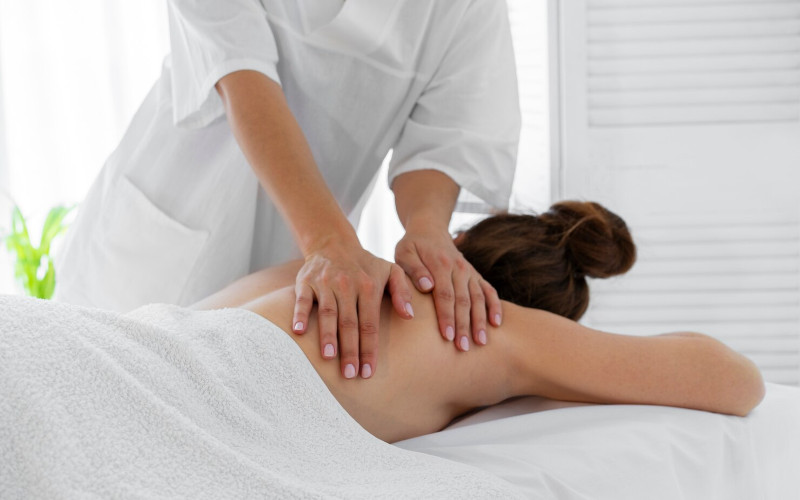 Lomi Lomi Hawaiian massage with flowing strokes at Uniq Massage McKinney TX