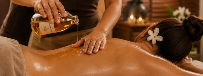 Sesame oil massage add-on at Uniq Massage in McKinney TX — warm Ayurvedic oil for deep nourishment and muscle warmth