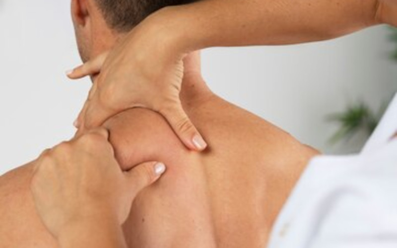 Licensed massage therapist at Uniq Massage in McKinney TX applying sports massage techniques for athletic recovery